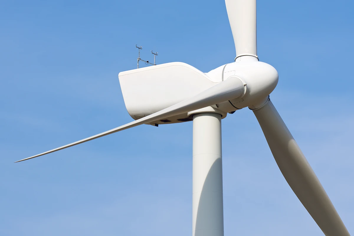 Technician conducting wind turbine maintenance – composites for wind turbine components provide reliability and efficiency in energy production.